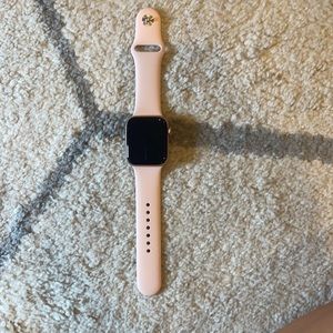 Rose Gold Apple Watch SE with additional bands